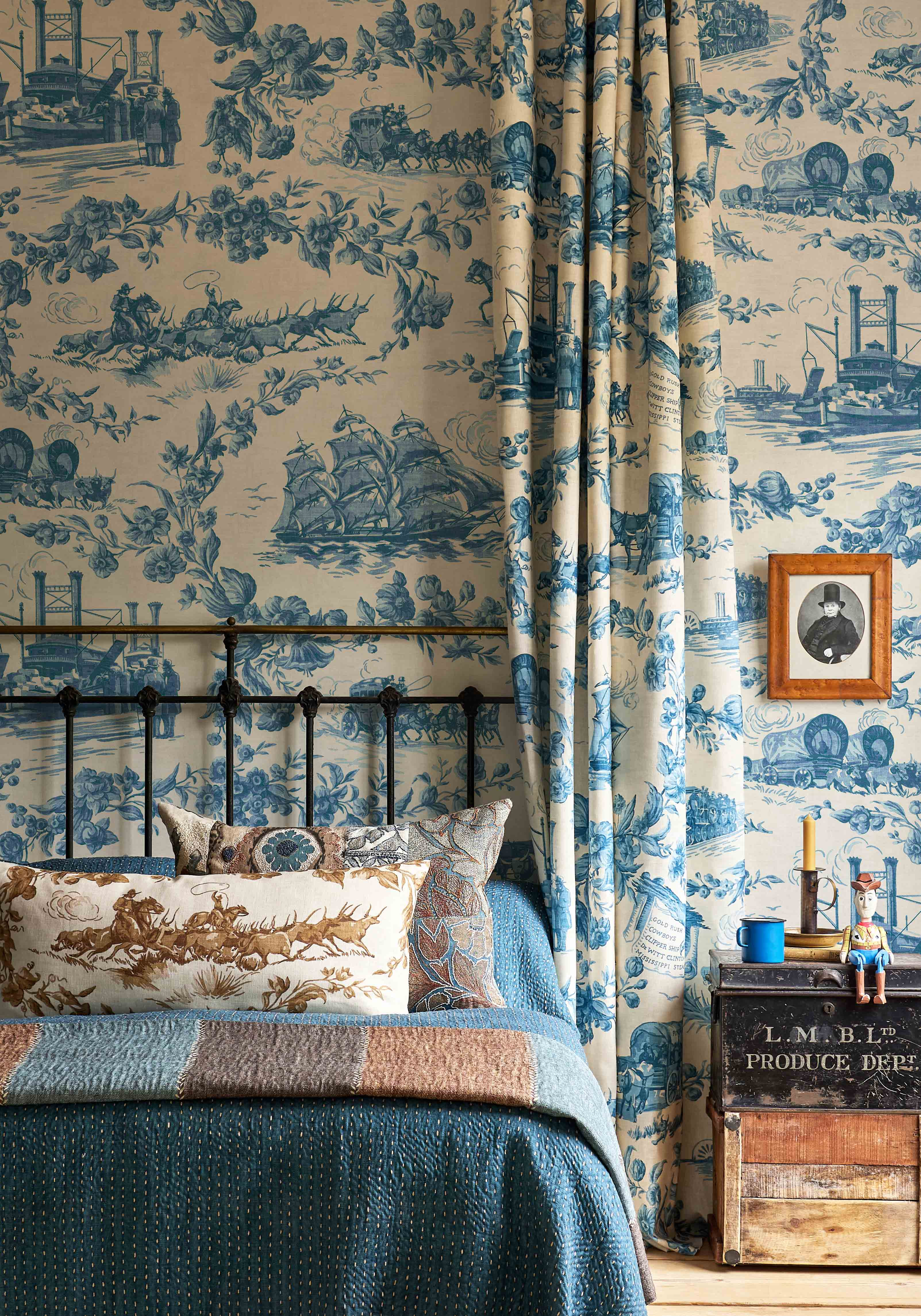 Pioneers blue wallpaper and curtain in bedroom lewis and wood