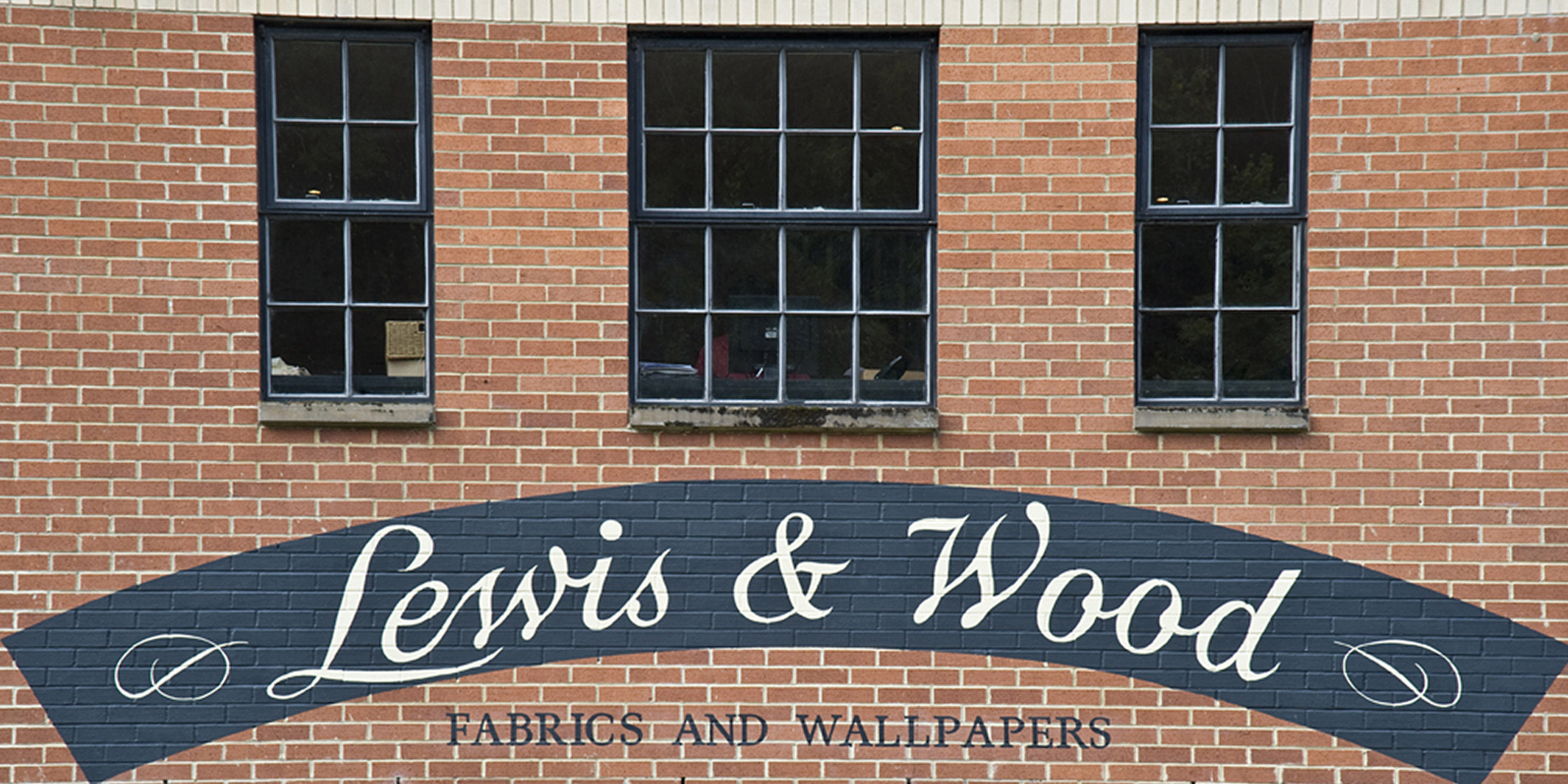 Lewis and Wood signage on red brick exterior wall